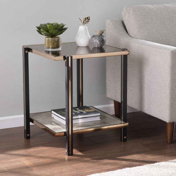 HomeRoots 24" Chic Champagne Glass End Table with Mirrored Surface & Shelf for Modern Living Spaces 402492