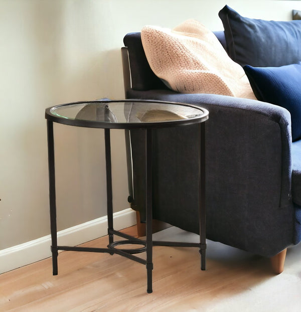 Homeroots 25" Black And Clear Glass Oval End Table   402501