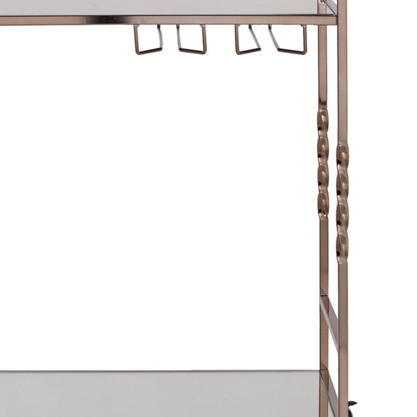 HomeRoots Champagne Metal Rolling Bar Cart with Mirrored Glass Top, Wine Storage & Smooth Mobility Features 402581
