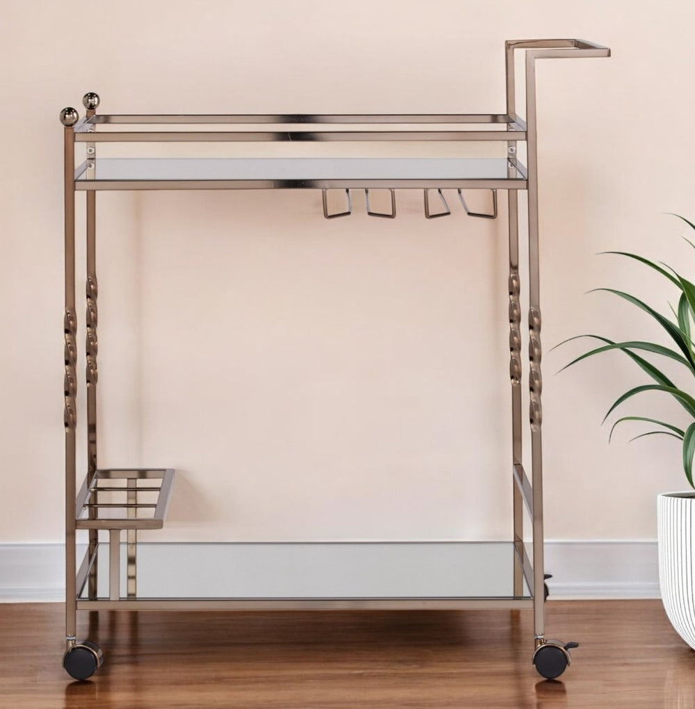 HomeRoots Champagne Metal Rolling Bar Cart with Mirrored Glass Top, Wine Storage & Smooth Mobility Features 402581