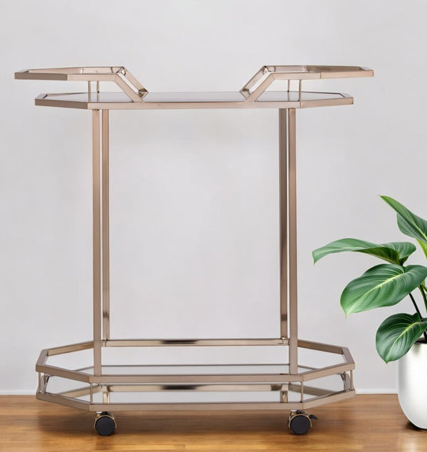 HomeRoots 31" Chic Octagonal Rolling Bar Cart - Champagne Iron Frame & Mirrored Glass for Elegant Entertaining 402583