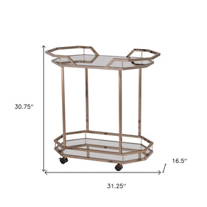 HomeRoots 31" Chic Octagonal Rolling Bar Cart - Champagne Iron Frame & Mirrored Glass for Elegant Entertaining 402583