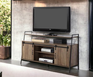 English Elm Rashawn Rustic Oak TV Stand with Black Frame, Sliding Barn Doors, 6 Compartments & Open Shelf B2726P256332