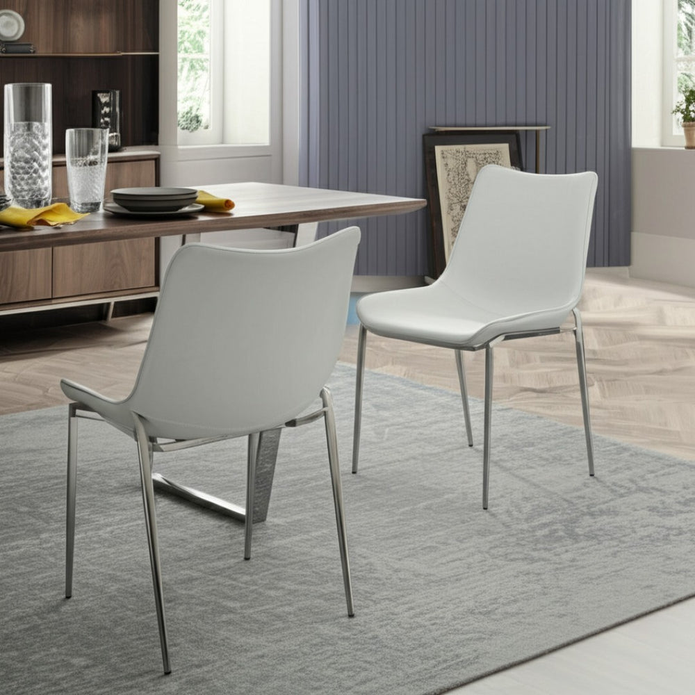 HomeRoots Set of Two Contemporary White Faux Leather Dining Chairs with Silver Legs for Versatile Use 472182