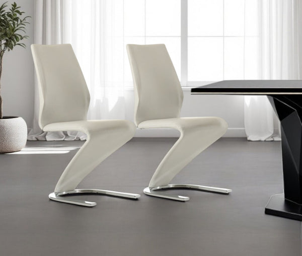 HomeRoots Set of Two Chic White and Silver Upholstered Faux Leather Dining Chairs for Versatile Spaces 472191