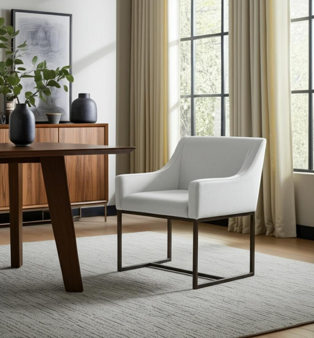 HomeRoots Beige Upholstered Dining Arm Chair with Antiqued Brass Legs - Stylish Comfort for Modern Spaces 472250