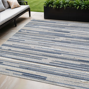 HomeRoots 5' Refreshing Blue Abstract Area Rug - Stain Resistant, Durable & Versatile for Indoor and Outdoor Spaces 5' X 7' Rectangle 473661