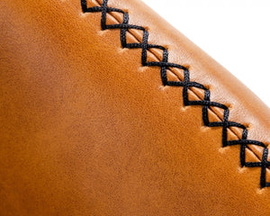 Homeroots 35" Carmel Brown Faux Leather Shelter Style Accent Chair   473831