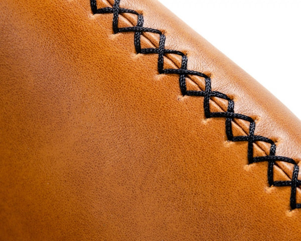 Homeroots 35" Carmel Brown Faux Leather Shelter Style Accent Chair   473831