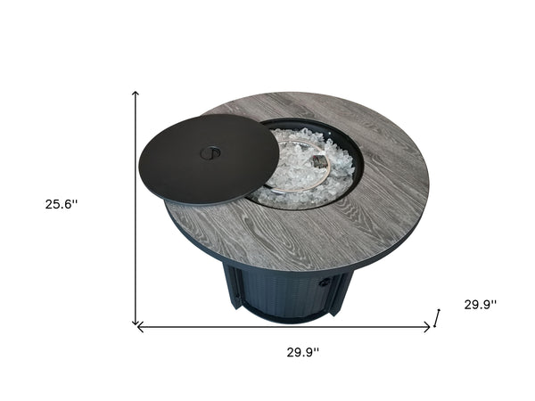 Homeroots Round Black Metal And Tile Fire Pit With Glass Rocks   475100