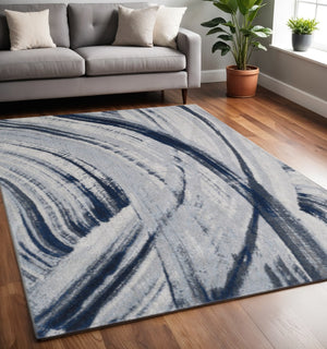 HomeRoots 5' Ivory and Blue Abstract Area Rug – Modern Design for Living Rooms, Durable & Stain-Resistant 5' X 8' 475253