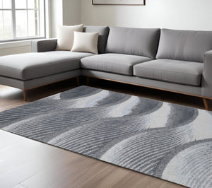 HomeRoots 10' Gray Blue Abstract Waves Area Rug - Modern Coastal Elegance for Living Rooms & Dining Areas 10' X 13' 475276
