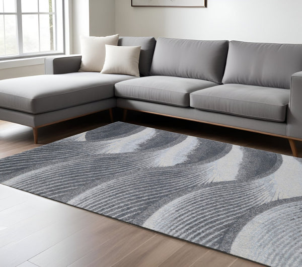HomeRoots 10' Gray Blue Abstract Waves Area Rug - Modern Coastal Elegance for Living Rooms & Dining Areas 10' X 13' 475276