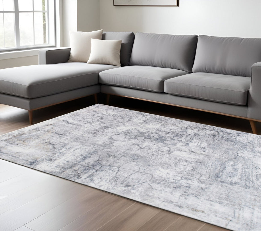 HomeRoots 5' Gray and Ivory Abstract Area Rug - Stylish, Durable, and Contemporary Design for Any Space 6' X 9' 475332
