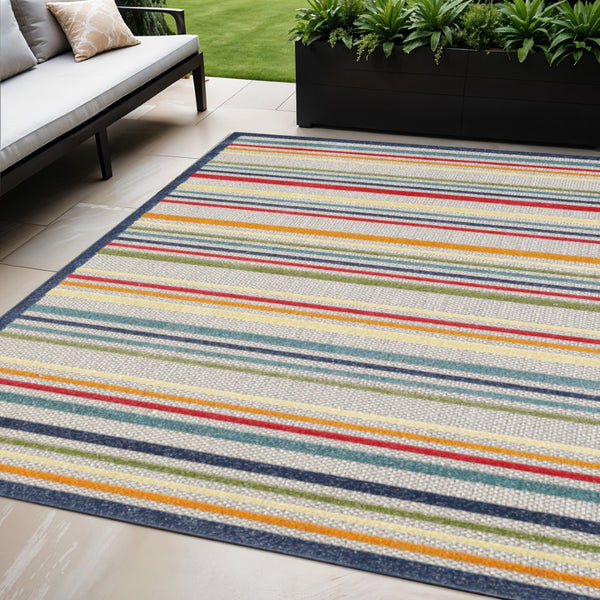 HomeRoots 5' Timeless Ivory and Blue Striped Stain-Resistant Area Rug for Indoor and Outdoor Spaces 5' X 7' Rectangle 475532