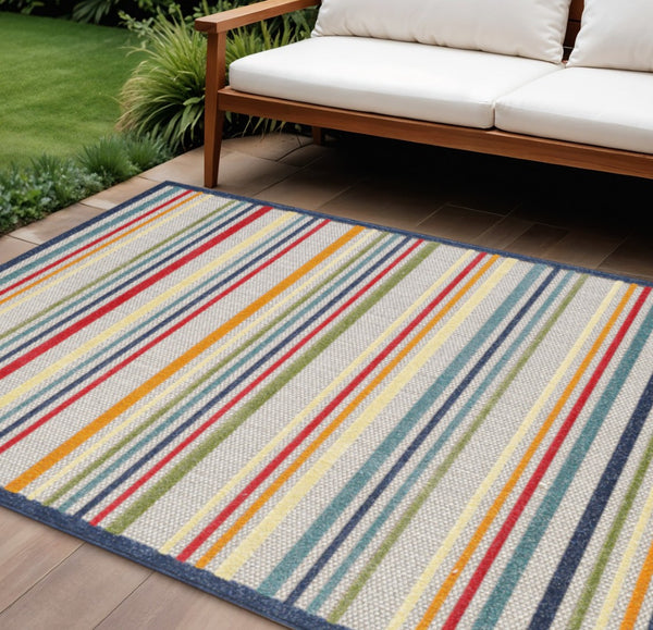 HomeRoots 5' Timeless Ivory and Blue Striped Stain-Resistant Area Rug for Indoor and Outdoor Spaces 7' X 9' Rectangle 475535