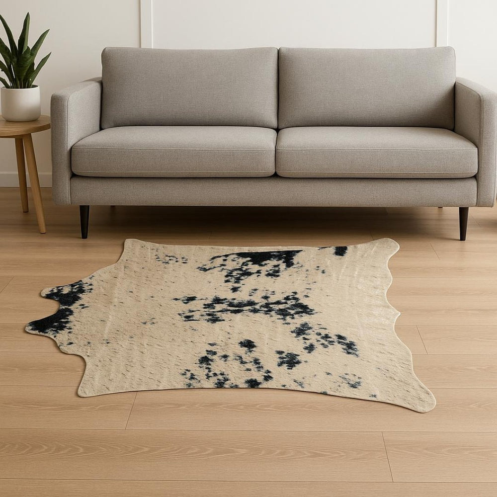 HomeRoots 4' X 5' Plush Faux Cowhide Area Rug - Modern Animal Print, Washable & Soft for Cozy Spaces Black, Gold 476679