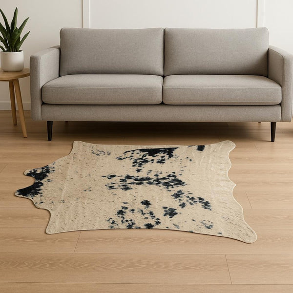 HomeRoots 4' X 5' Plush Faux Cowhide Area Rug - Modern Animal Print, Washable & Soft for Cozy Spaces Black, Gold 476679
