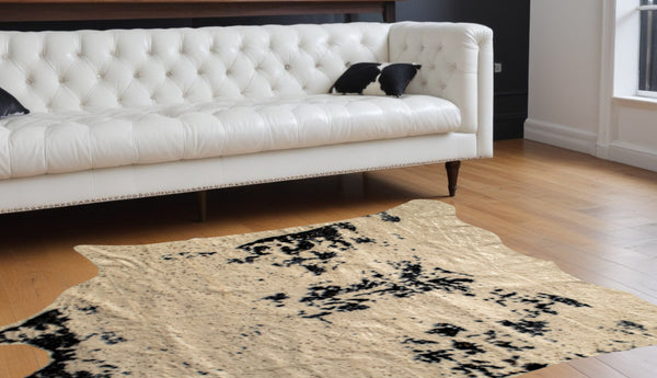 Homeroots 5' X 8' Off White Black And Gold Faux Cowhide Washable Area Rug  Acrylic 476682