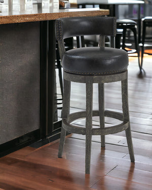 Homeroots 26" Black And Dark Gray Faux Leather And Wood Swivel Low Back Counter Height Bar Chair   477289