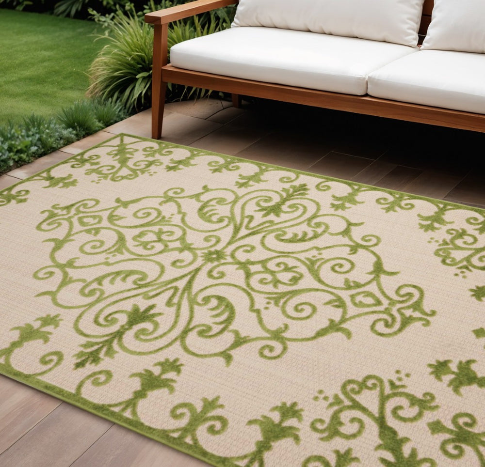 HomeRoots 10' Green Indoor Outdoor Area Rug - Durable, Stylish Damask Design for Versatile Living Spaces 479298