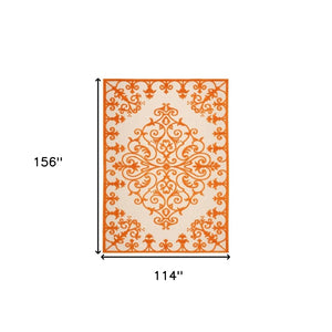 HomeRoots 10' Orange and Ivory Area Rug - Stylish Indoor/Outdoor Damask Design, Durable, Easy-Care, Versatile! 479300