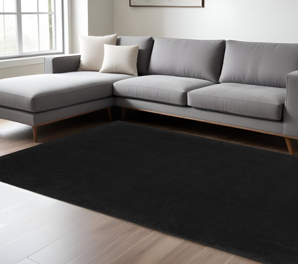 HomeRoots 7' X 10' Black Indoor Outdoor Area Rug - Durable, Stylish, and Versatile for High-Traffic Spaces 479444