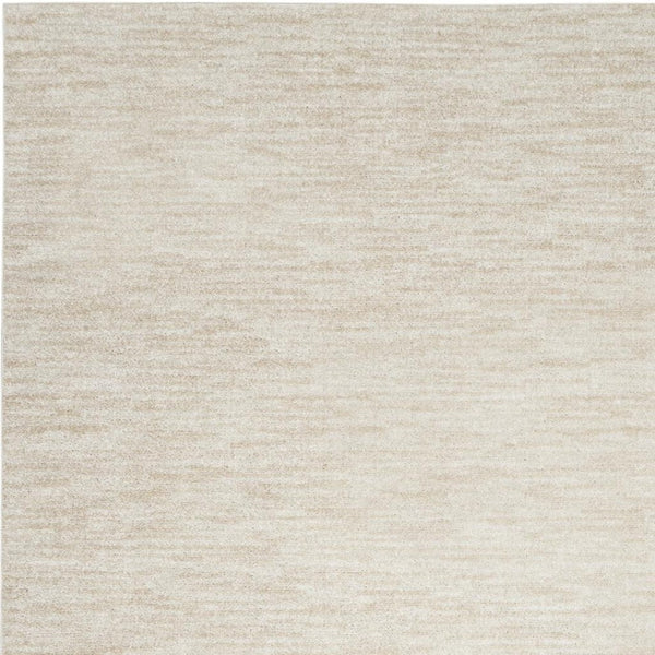 HomeRoots 7' X 10' Beige and Ivory Area Rug - Stylish Low-Pile Indoor/Outdoor Rug for All Décor Styles 479508