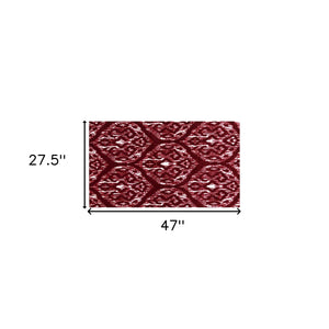 Homeroots 2' X 4' Red And White Ikat Tufted Washable Non Skid Area Rug  Nylon 482717