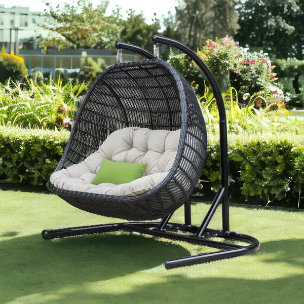 Homeroots 69" Beige And Black Aluminum Indoor Outdoor Swing Chair With Beige Cushion  Rattan,Aluminium,Fabric 482868