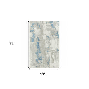 Homeroots 4' X 6' Ivory Gray And Blue Abstract Stain Resistant Area Rug  Polyester 483032