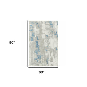 Homeroots 5' X 8' Ivory Gray And Blue Abstract Power Loom Stain Resistant Area Rug  Polyester 483033