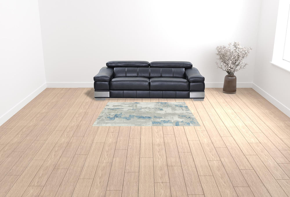 Homeroots 5' X 8' Ivory Gray And Blue Abstract Power Loom Stain Resistant Area Rug  Polyester 483033