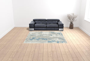 Homeroots 8' X 10' Ivory Gray And Blue Abstract Power Loom Stain Resistant Area Rug  Polyester 483034