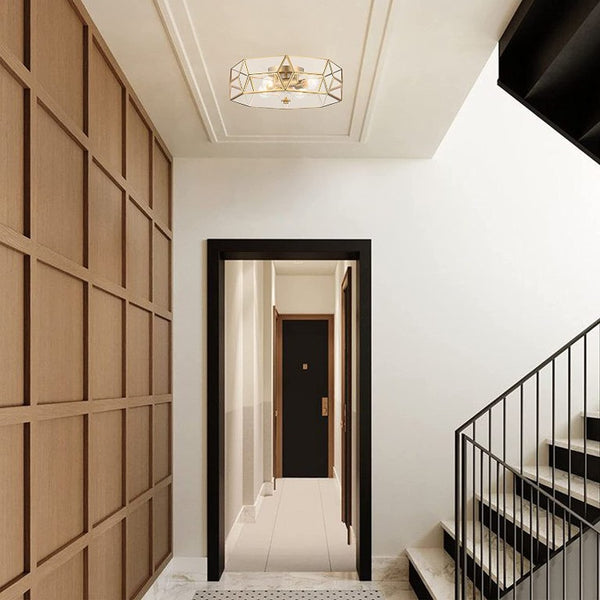 Brass Four Light Dimmable Flush Mount Chandelier with Clear Glass Shades for Modern Interiors