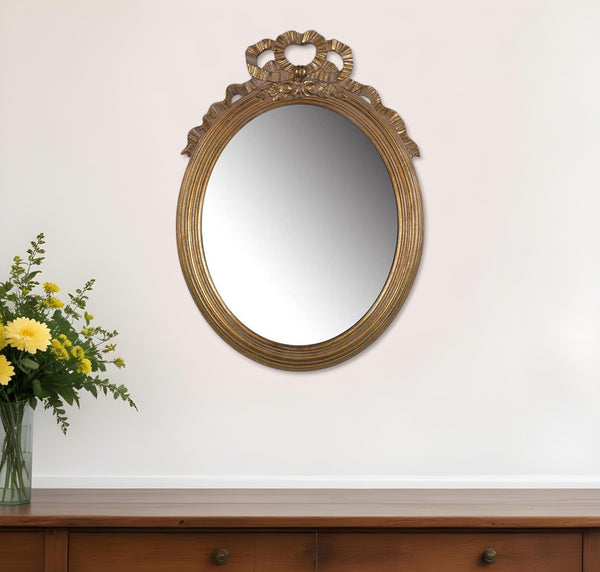 Homeroots 26" Gold Crowned Top Resin Framed Accent Mirror  Polyresin 485041