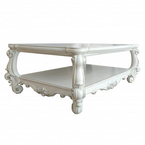 Homeroots 57" Antiqued White Solid And Manufactured Wood Coffee Table With Shelf   486048