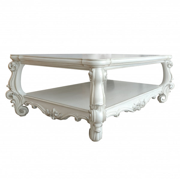 Homeroots 57" Antiqued White Solid And Manufactured Wood Coffee Table With Shelf   486048