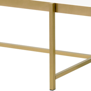 Homeroots 54" Gold And Clear Glass Oval Coffee Table   486051