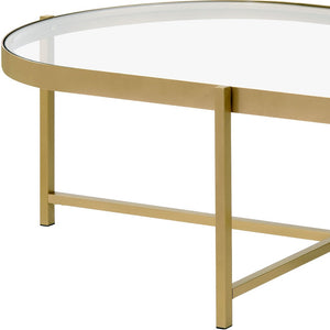 Homeroots 54" Gold And Clear Glass Oval Coffee Table   486051