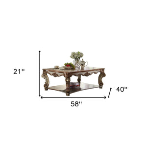 Homeroots 58" Gold Solid And Manufactured Wood Coffee Table With Shelf   486056