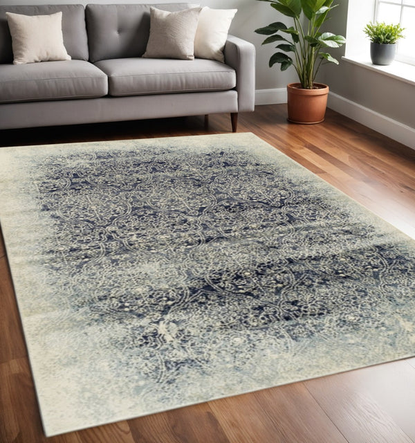 HomeRoots 5' Navy Blue and Ivory Medallion Area Rug - Stylish, Stain-Resistant, Perfect for Family Spaces 5' X 8' 486645
