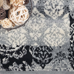 Homeroots 8' X 10' Black And Gray Damask Power Loom Distressed Stain Resistant Area Rug  Polypropylene 486972