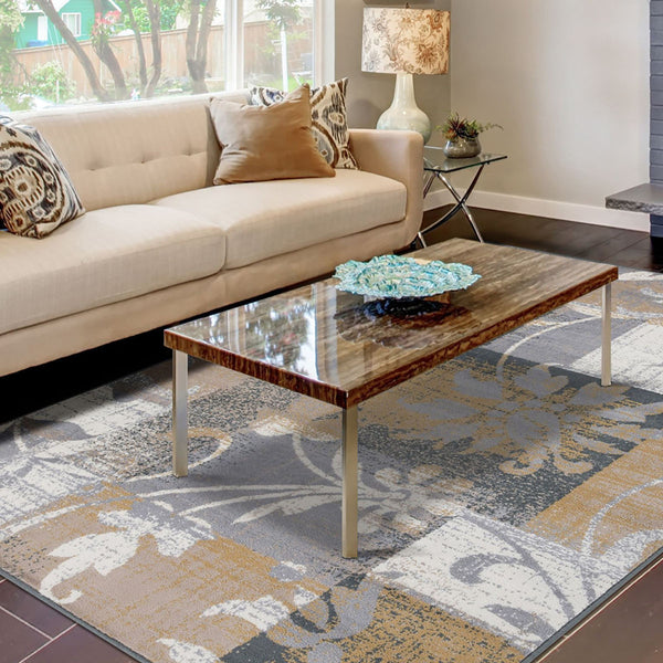 Homeroots 7' X 9' Beige And Gray Floral Power Loom Distressed Stain Resistant Area Rug  Polypropylene 487003