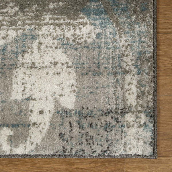 Homeroots 7' X 9' Teal Gray And Tan Floral Power Loom Distressed Stain Resistant Area Rug  Polypropylene 487004