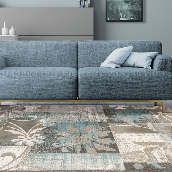 Homeroots 7' X 9' Teal Gray And Tan Floral Power Loom Distressed Stain Resistant Area Rug  Polypropylene 487004