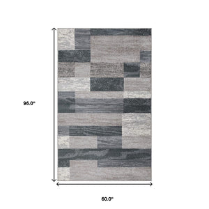 Homeroots 5' X 8' Blue And Taupe Patchwork Power Loom Stain Resistant Area Rug  Polypropylene 487091