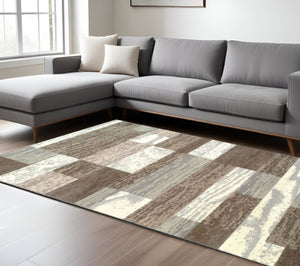 HomeRoots 7' Blue and Ivory Patchwork Area Rug - Durable, Stylish Design for High-Traffic Homes and Spaces 7' X 9' 487103