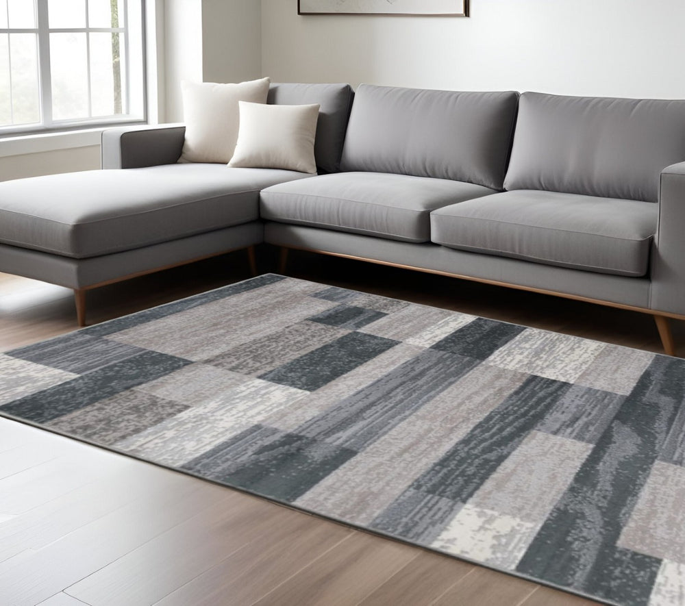 HomeRoots 8' Blue and Gray Patchwork Area Rug – Durable, Stain-Resistant, Perfect for Living Spaces and Family Life 8' X 10' 487109