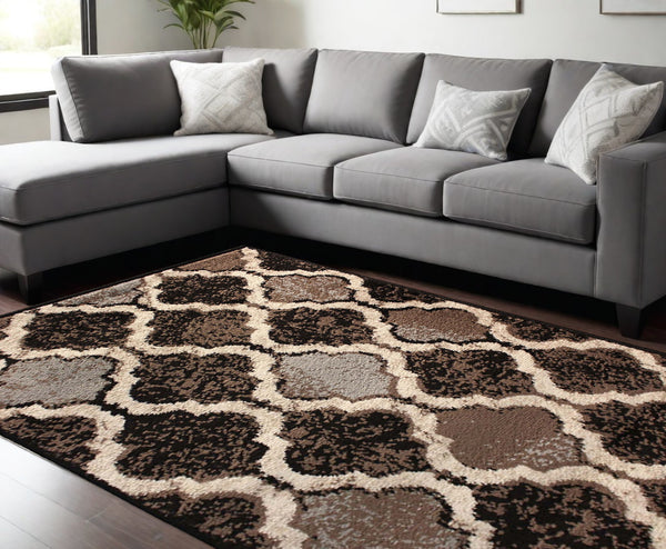 Homeroots 9' X 12' Chocolate Quatrefoil Power Loom Distressed Stain Resistant Area Rug  Polypropylene 487243